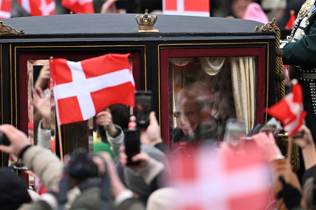 Queen Margrethe II of Denmark reacts as she rides 