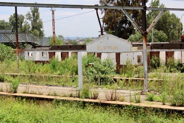 A faded sign is about all that is recognisable of Kliptown train station. Photos: Masego Mafata/GroundUp