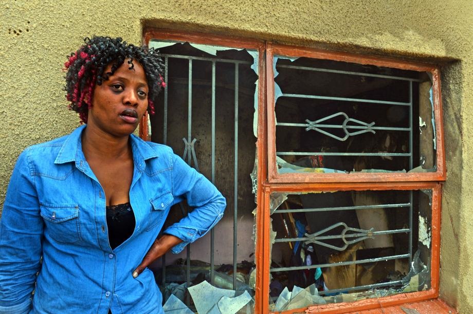Caption Nonzuzo Ntloko (32) from Rockville,Soweto said the fire started her room when kids threw crickets and burn the house..Photo by Lucky Morajane  