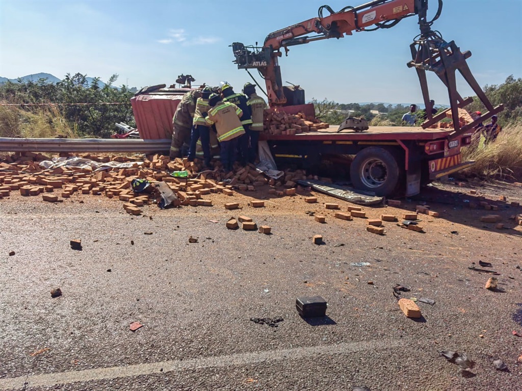 A truck carrying bricks collided with another truc