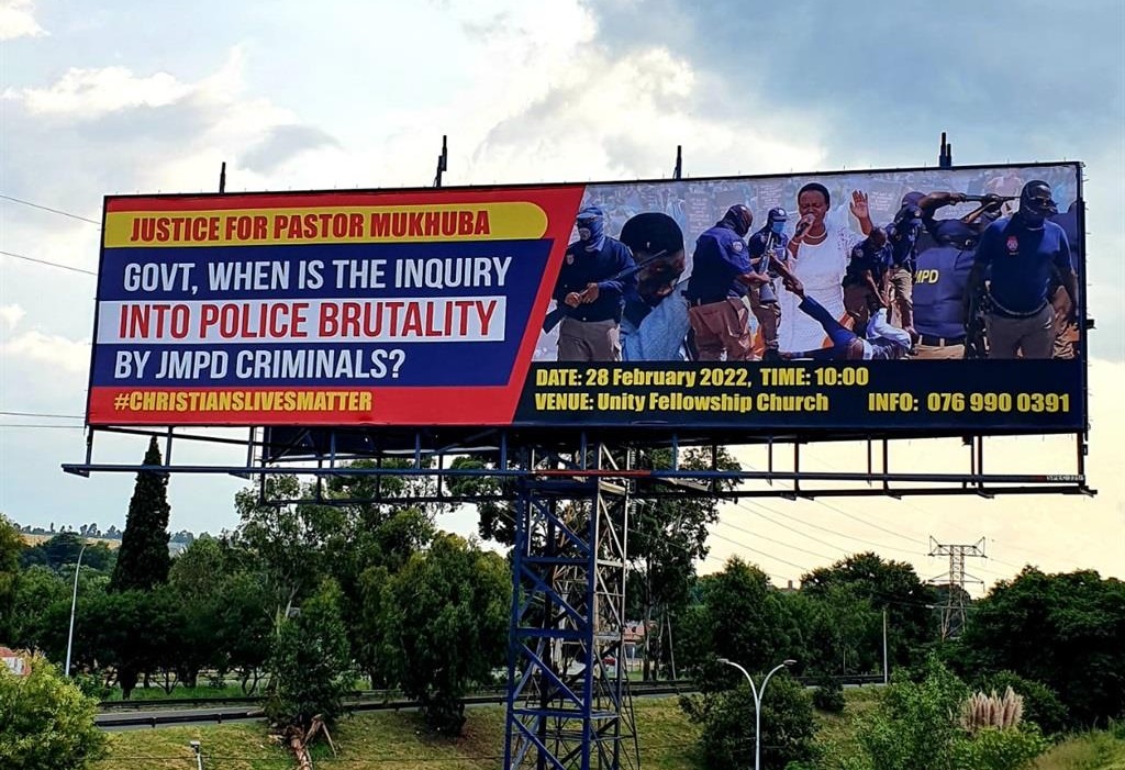 Billboard depicting police brutality