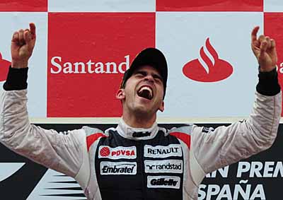 <b>NO PAIN IN SPAIN:</b> Pastor Maldondo's ecstasy after winning the 2012 Spanish F1 GP was followed by a brave rescue in Williams' garage blaze.