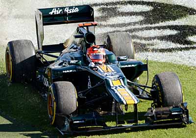 <b>OUT TO GRASS:</b> Caterham's Heikki Kovalainen of Finland runs out of track during the 2012 F1 GP in Melbourne. He finished seventh after starting 18th. <i>Image: AFP</i>