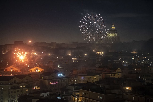 Fireworks are seen over St. Peters Basilica on New Year's Eve during the Coronavirus pandemic on 1 January 02021, in Rome, Italy. (Photo by Antonio Masiello/Getty Images)