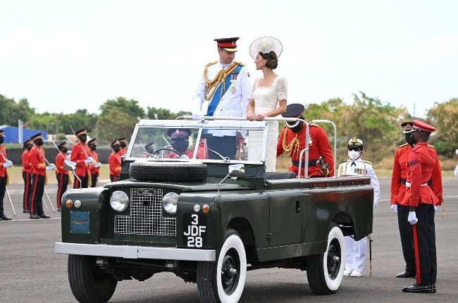 Prince William and Kate Middleton stand on a military Land Rover during a military parade in Jamaica during their official tour of the Caribbean. (PHOTO: Gallo Images/Getty Images)