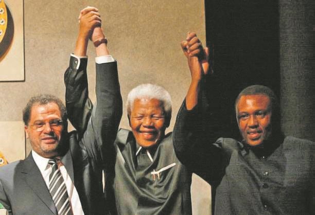 Danny Jordaan, Nelson Mandela and Irvin Khoza celebrate after SA is  announced as the host. Photo: Alexander Joe/AFP/Getty Images