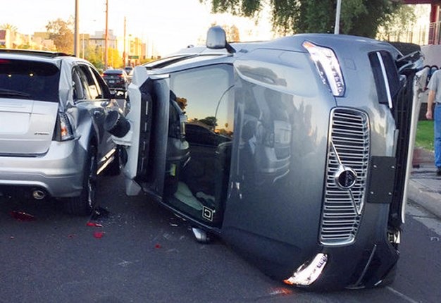<b>IMPERFECT TECHNOLOGY:</b> An Uber self-driving SUV flipped on its side in a collision in Tempe, Arizona. The crash serves as a stark reminder of the challenges surrounding autonomous vehicles in Arizona. <i>Image: Tempe Police Department via AP</i>