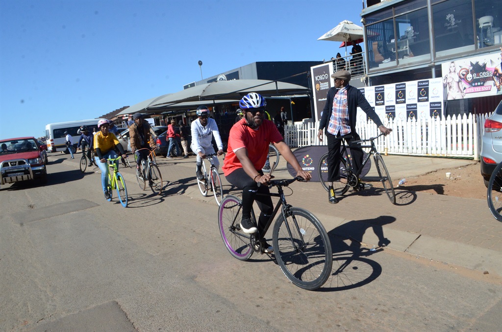 Gauteng Tourism guests ride bikes around Vosloorus, Ekurhuleni. Photo by Happy Mnguni