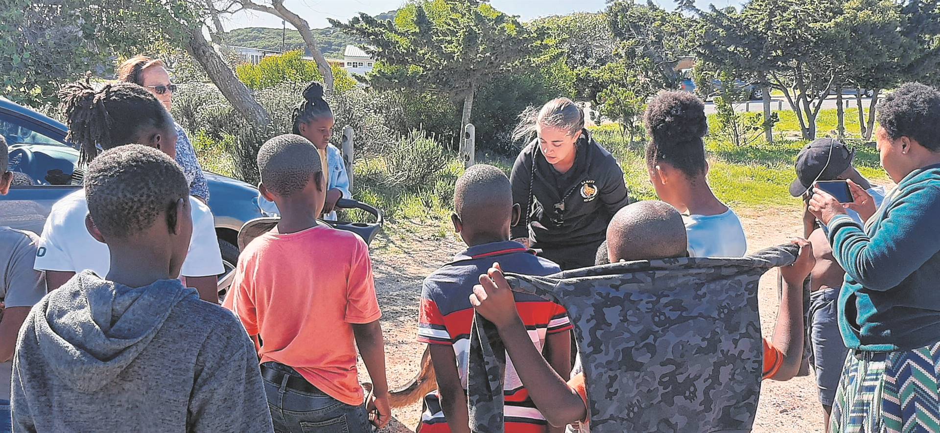 Children from Da Gama Park learned how to approach and interact with K9 Zara at the launch of Da Gama Dog Club. PHOTO: Supplied