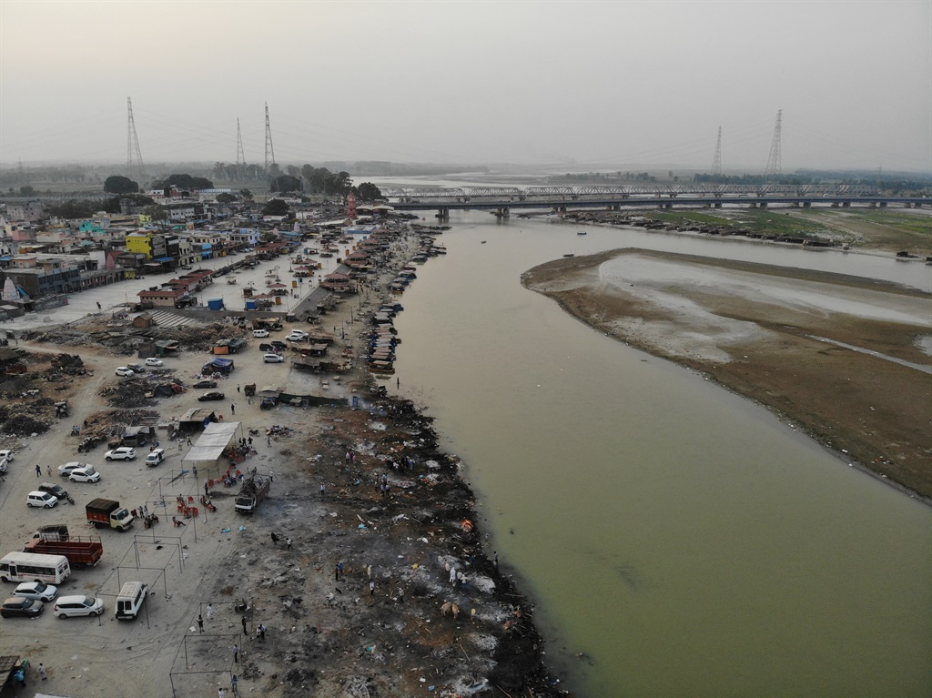 In this aerial photograph taken on May 5, 2021 funeral pyres of Covid-19 coronavirus victims are seen in a cremation ground along the banks of the Ganges River, in Garhmukteshwar.
