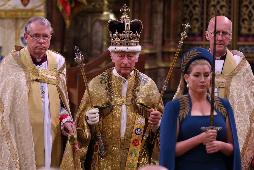 Britain's King Charles III walks wearing St Edward