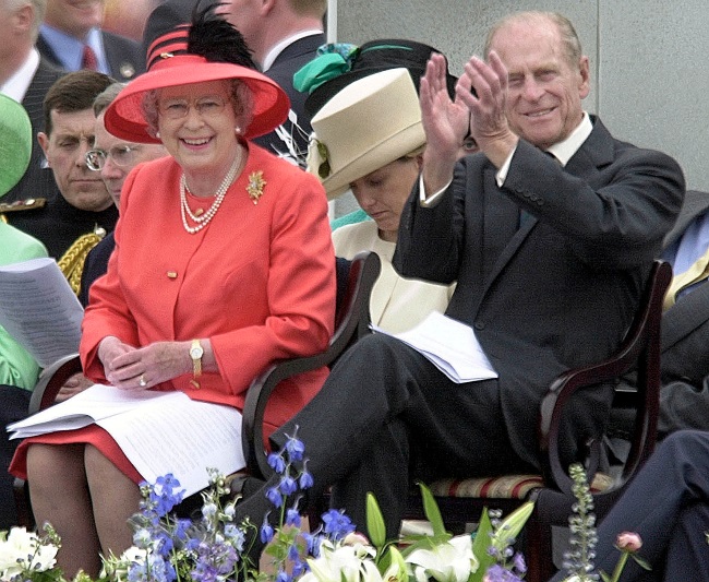 The queen and prince Phillip enjoy a parade in The