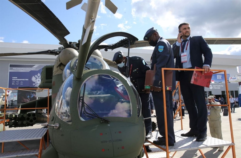 Officers from Rwanda observe the Mi-35M military transport helicopter exposed at the International Military-Technical Forum "Army-2021" at the Partiot Park in Kubinka, outside of Moscow, Russia last year.