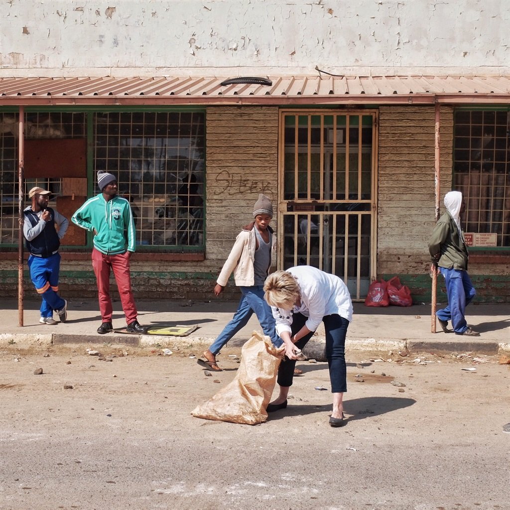 Residents of Coligny try pick up the pieces after violent protests. Picture: Tebogo Letsie