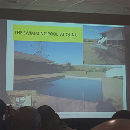 <p>The minister is now showing the media a
picture of late former president Nelson Mandela’s Qunu home.

</p><p>“It also had a firepool,” he says.

</p>