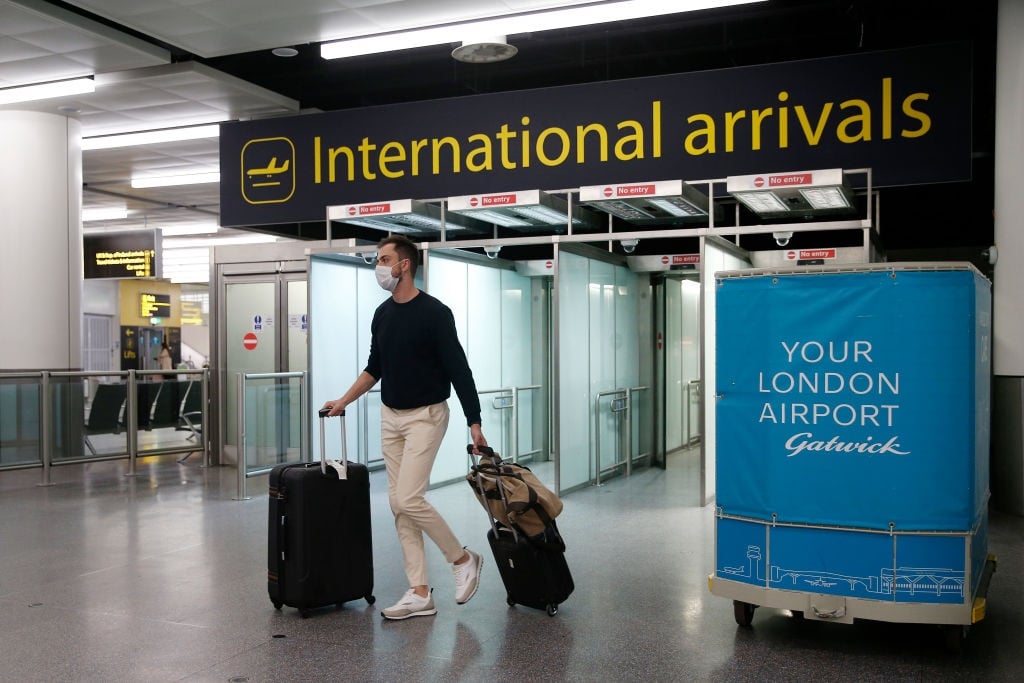 A traveller arrives at the North Terminal at Gatwick Airport in London, England. 