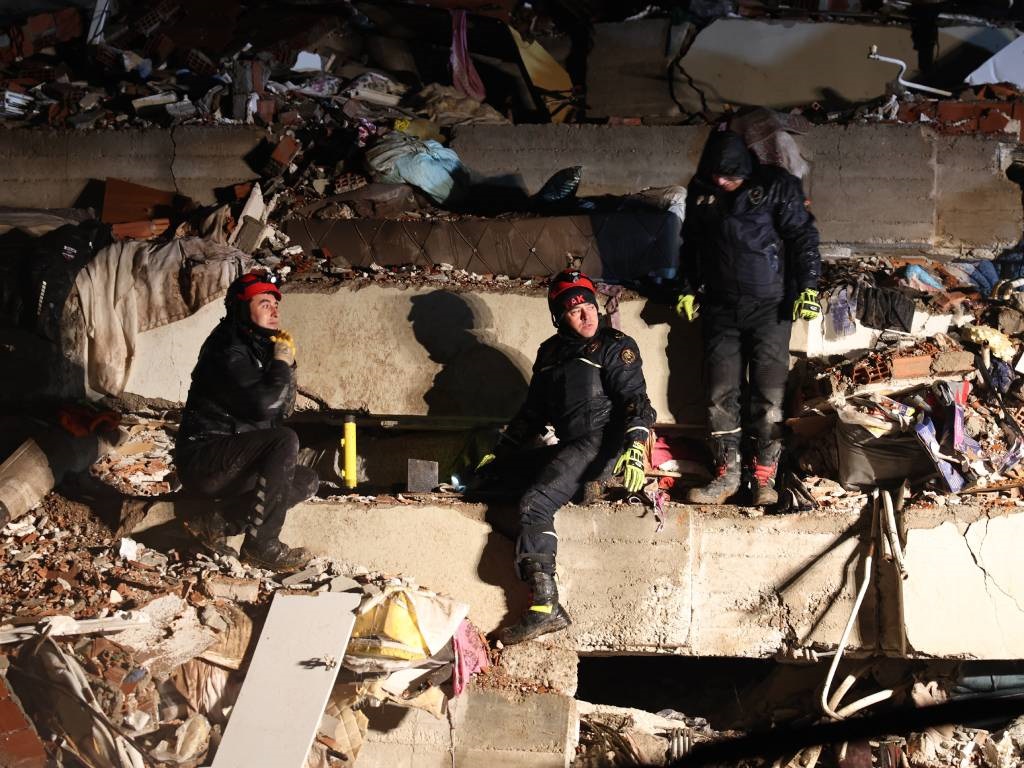 Rescuers search for victims and survivors amidst the rubble of collapsed buildings in Kahramanmaras, Turkey, after a 7.8-magnitude earthquake struck the country's southeast.
