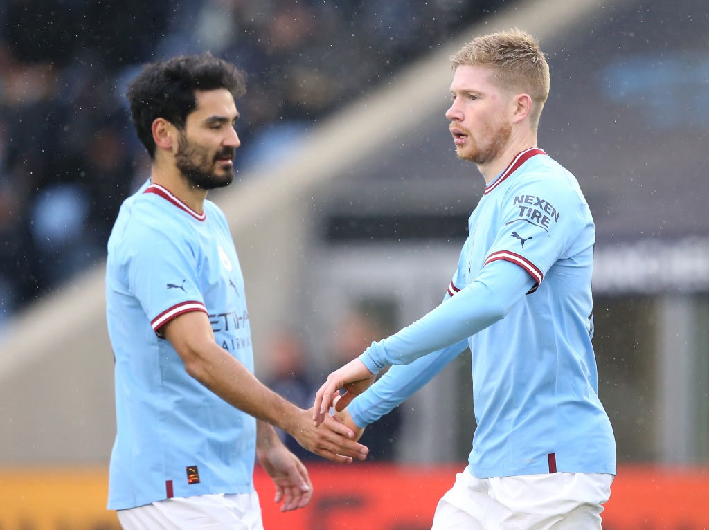 MANCHESTER, ENGLAND - DECEMBER 17: Kevin De Bruyne of Manchester City celebrates after scoring their sides first goal with Ilkay Gundogan during the friendly match between Manchester City and Girona at Manchester City Academy Stadium on December 17, 2022 in Manchester, England. (Photo by Jan Kruger/Getty Images)