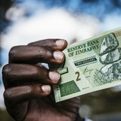 Zimbabwe imposes capital controls to stem currency's slide
