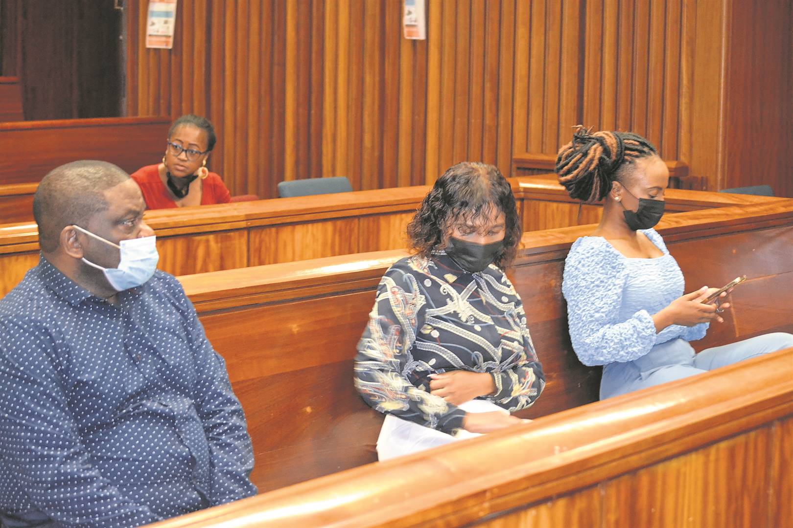 From left: Co-accused Zukiswa Sitho and Lusanda Sulani with Timothy Omotoso in the Port Elizabeth High Court.     Photo by Luvuyo Mehlwana