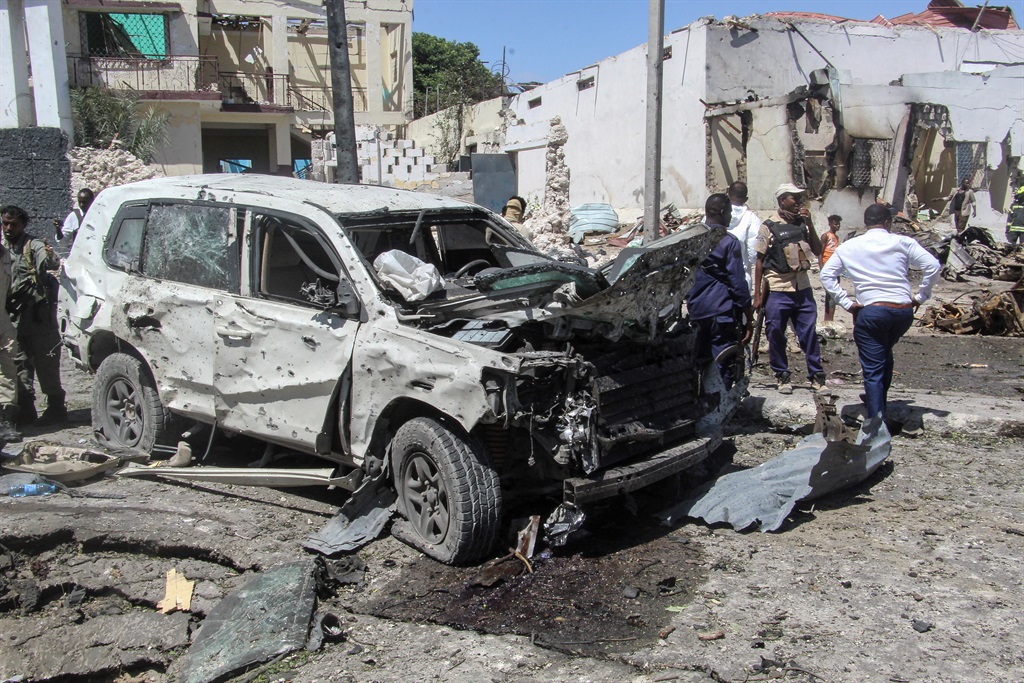 A  general view of the scene of a car-bomb explosion in Mogadishu on January 12, 2022 where at least six people were killed and several others wounded in the huge blast that caused devastation in the area along the 21st October road.
At least six people were killed and undisclosed number of others wounded after a huge car bomb explosion rocked along a road in southern Mogadishu causing casualties and devastation.
STRINGER / AFP
