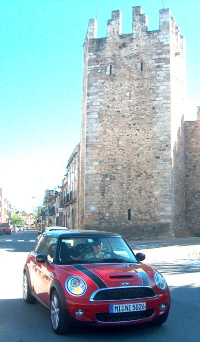 MINI-Cooper S dwarfed by this castle rampart in Spain's Catalunya region