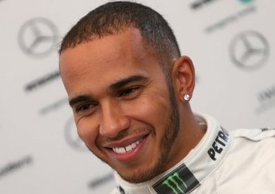 <b>SHOWING WHAT HE'S GOT</b>Mercedes driver Lewis Hamilton and his team are all smiles when the Brit took his first pole position ahead of the China GP on Sunday. (April 14, 2013) <I>Image: AFP</i>