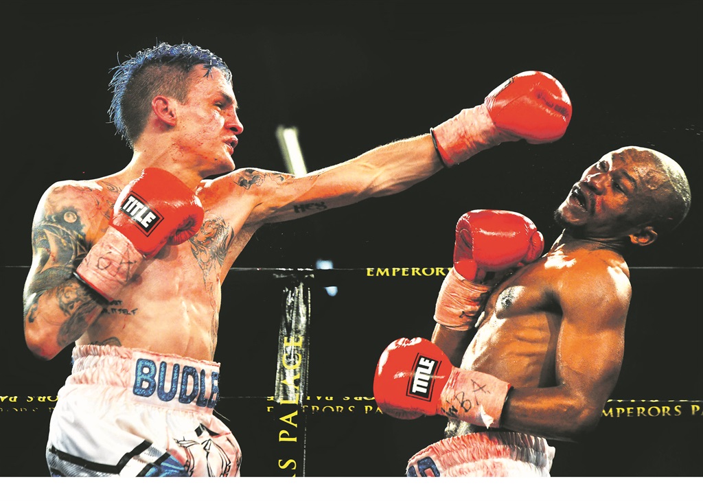 WBA and IBO minimumweight champion Hekkie Budler throws a punch at Simphiwe Khonco  PHOTO: Leon SADIKI 