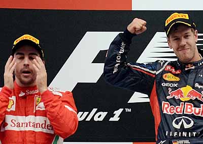 <b>STILL IN THE FIGHT?</b> Fernando Alonso (left) reckons he still has a change at the 2012 F1 GP title over Sebastian Vettel (right). <i>Image: AFP</i>