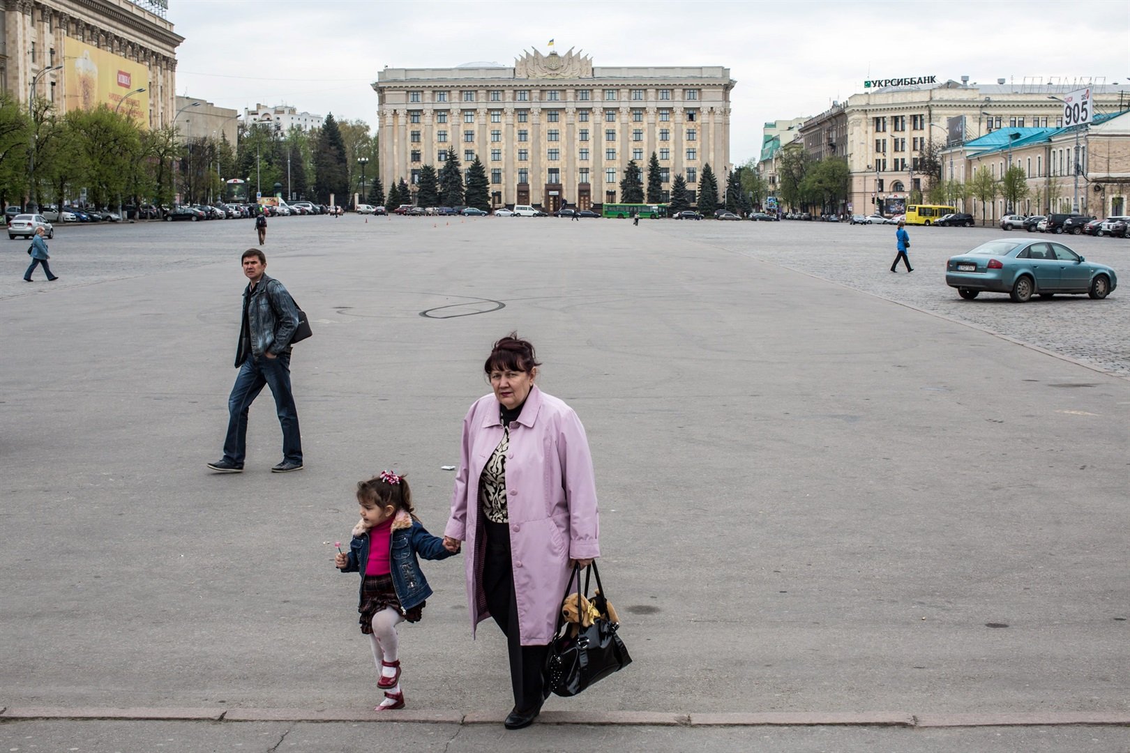 Pedestrians pass through Freedom Square in Kharkiv, Ukraine.