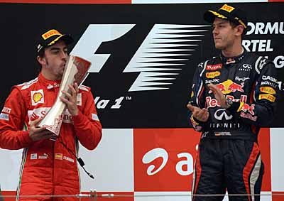 <b>2012 INDIAN PODIUM:</b> Fernando Alonso (left) was second, Sebastian Vettel (right) won - battle will recommence on Sunday in Abu Dhabi. <i>Image: AFP</i>