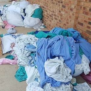 Soiled bedding scattered outside the KwaMhlanga hospital. (Image Supplied)