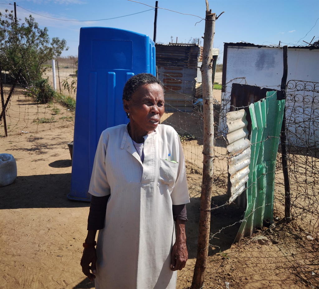 Gogo Elishia Modise from Colingy said using a bucket toilet for eight years has affected her health. Photo by Trevor Kunene