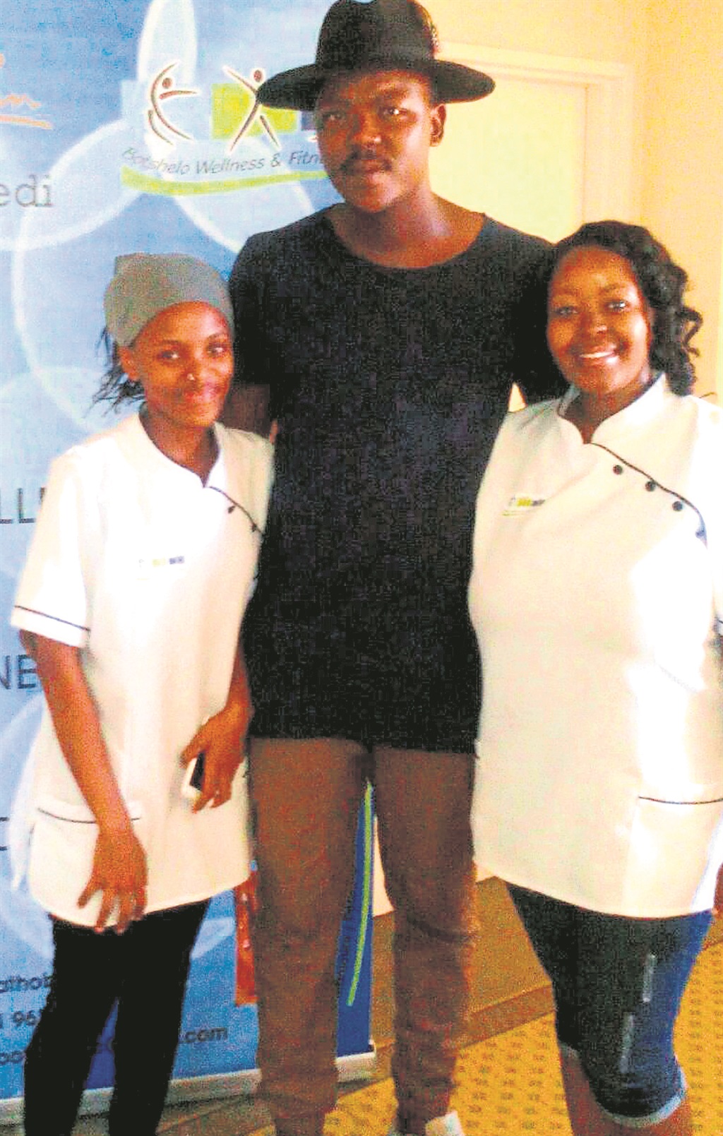 Tol Ass Mo took a picture with Kabelo (left) and her sister Tumelo (right) after having a full body massage on 26 December.                    Photo supplied         by Tumelo Rathobei 