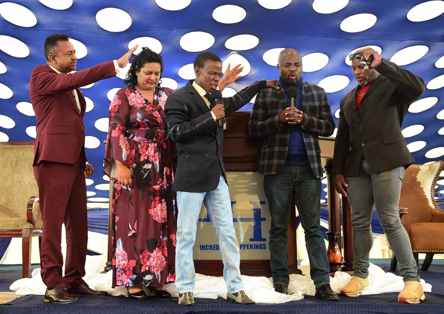From left: Pastor Jeff Naidoo and his wife Cookie, with Pastor Paseka ‘Mboro’ Motsoeneng, Pastor Enoch Phiri and Mandoza’s former bodyguard, Smodern ‘Batista’ Dzimba, praying together to overcome hurdles such as depression and poverty.   Photo by Morapedi Mashashe