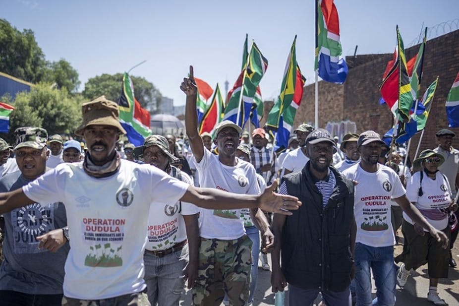 Members of South Africa’s anti-migrant “Operation Dudula” group march in Jeppestown, Johannesburg. Michele Spatari / AFP via Getty Images