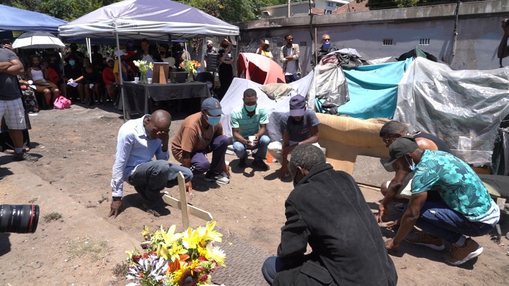 A large group braved Cape Town's heat to mourn the