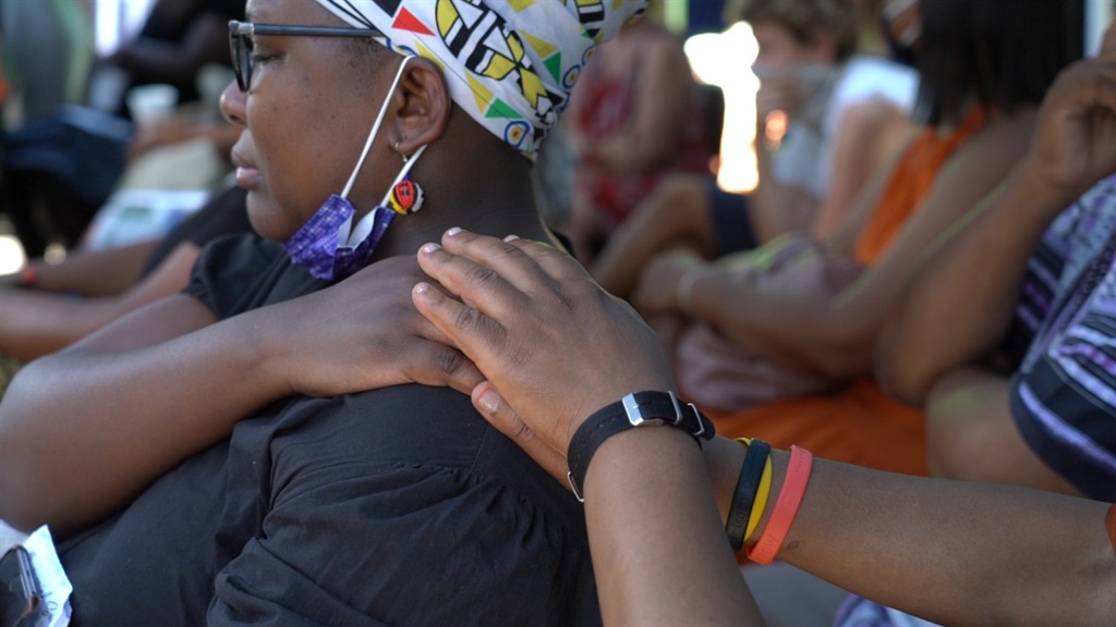 A large group braved Cape Town's heat to mourn the