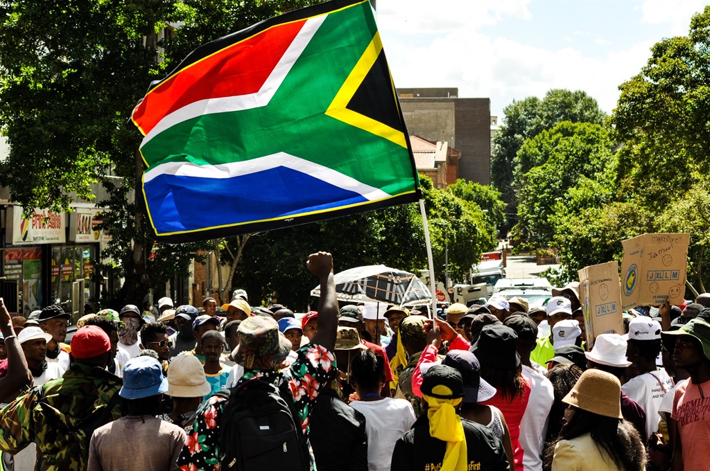 Minister Nathi Mthethwa believes his department has a mandate to foster a national appreciation of the South African flag and heritage, so it justifies all costs, writes the author.