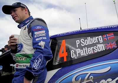 <b>ALMOST THE END:</b>  Petter Solberg drinks an early-morning coffee ahead of the second stage of the 48th Rally of Catalonia on November 10 2012. <i>Image: AFP</i>