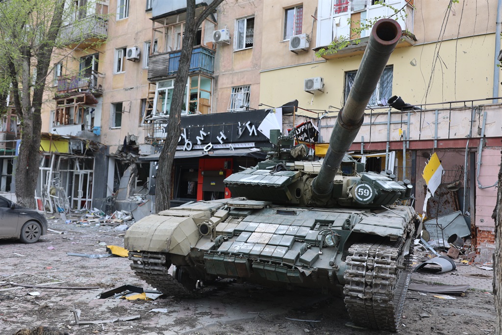 Military tank seen in middle of city scape