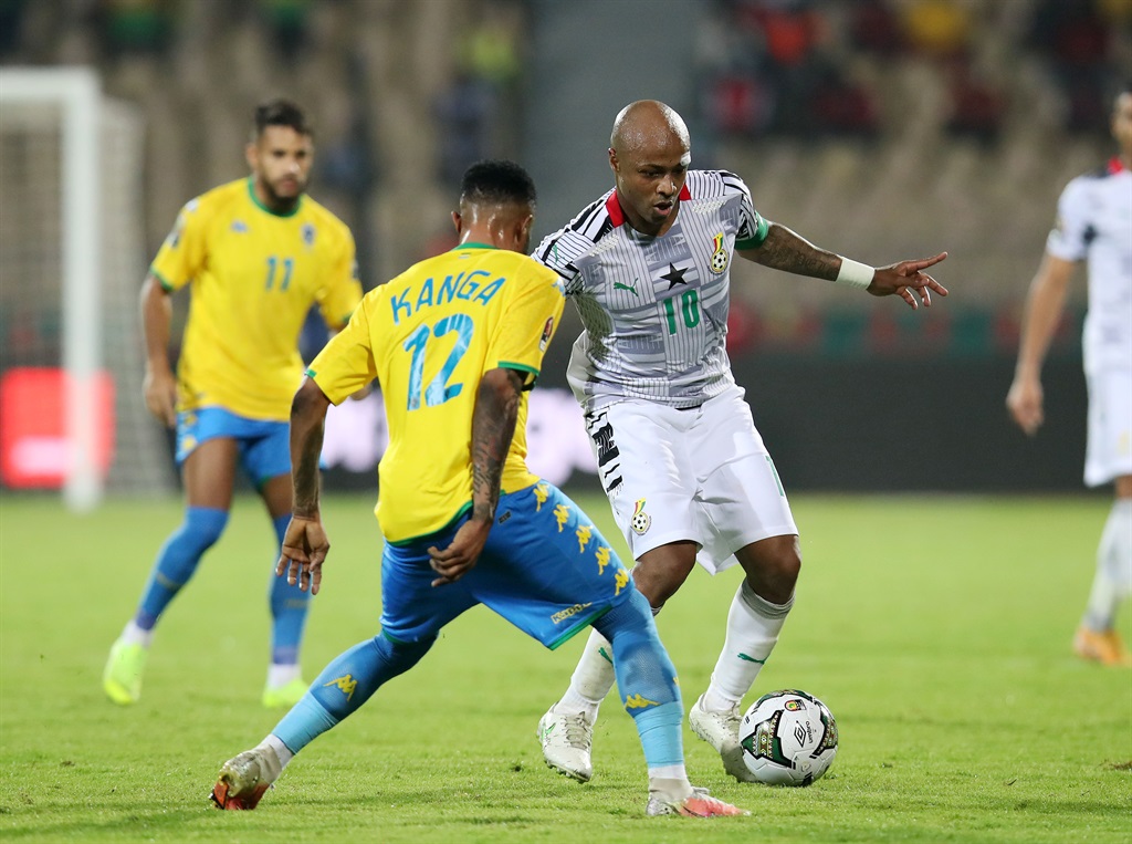 Andre Ayew of Ghana challenged by Guelor Kanga of 