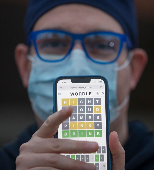 ICU Dr. Joshua Landy shows off a screengrab from one of his earlier Wordle games. The online word game that has gone viral is helpful, he says, as a mental break from his demanding work. (Photo: Rick Madonik/Toronto Star via Getty Images)