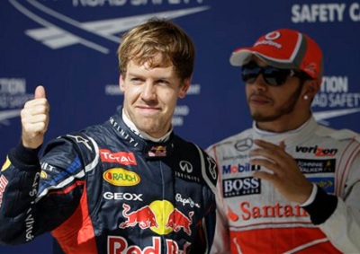 <b>VETTEL ON POLE:</b> Red Bull's Sebastian Vettel (L) earns pole position for the 2012 US Grand Prix.