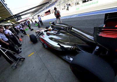 <b>ANOTHER DOMINANT DISPLAY:</b> McLaren's Lewis Hamilton enters the pits garage during the second free practice session at Interlagos on Friday.