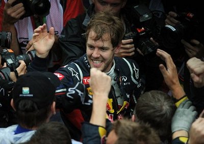 <b>2012 F1 CHAMPION:</b> Sebastian Vettel celebrates his sixth place finish in the Brazilian F1 GP and his third Driver's title in a row.