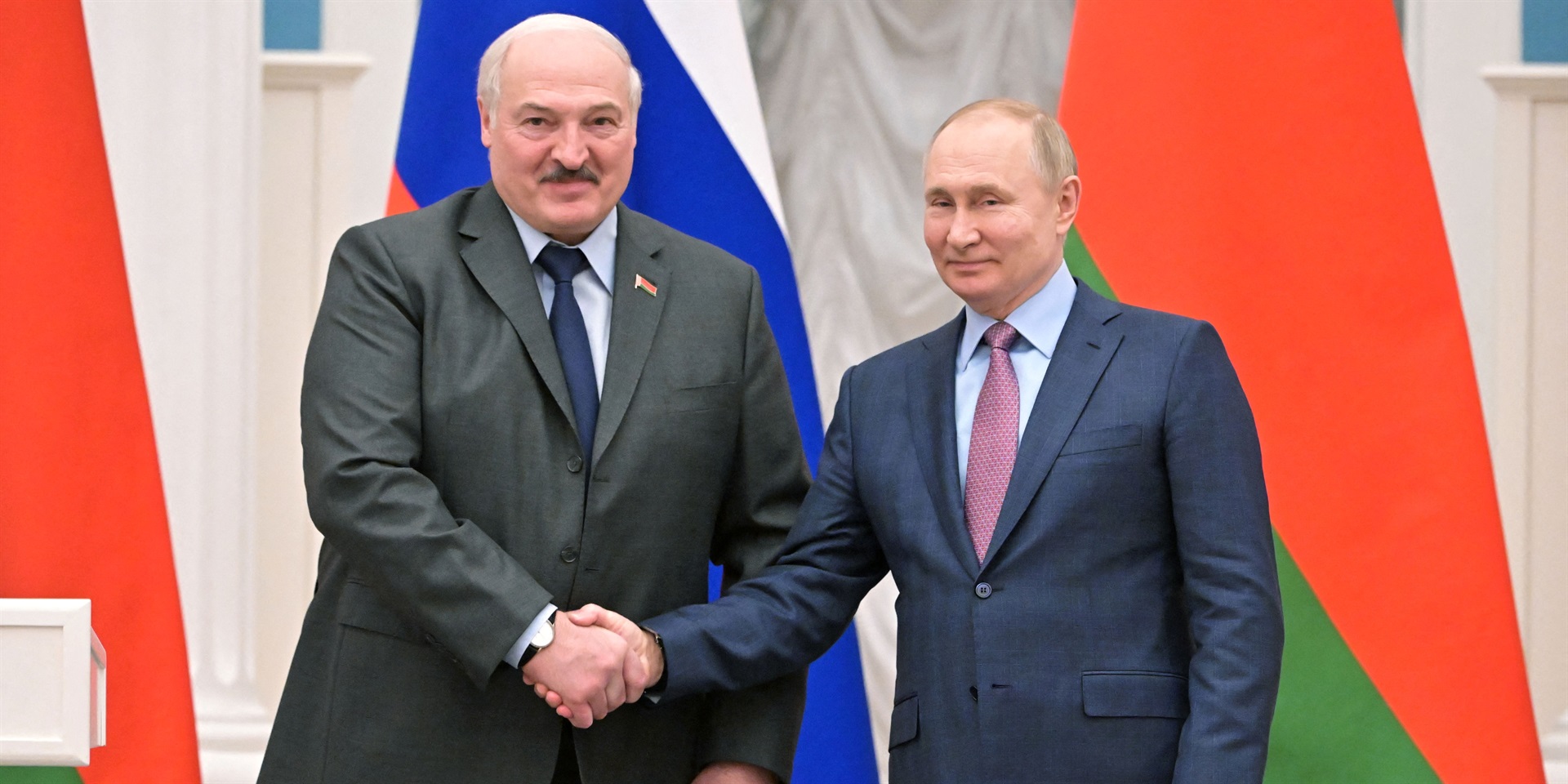 Russia's President Vladimir Putin (R) shakes hands with his Belarus counterpart Alexander Lukashenko (L) during a press conference following their talks at the Kremlin in Moscow on February 18, 2022. Sergei Guneyev/Sputnik/AFP/Getty Images