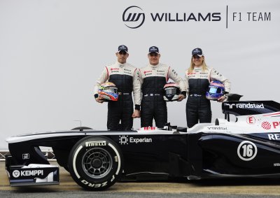 <b>THE WINNER?</b> Williams' driver Pastor Maldonado (Left), Valtteri Bottas and British development driver Susie Wolff pose behind the Williams FW35.