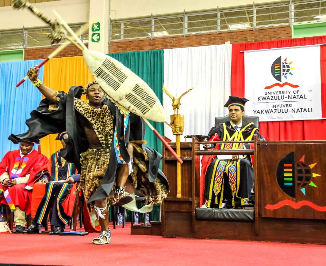 A file photo of a University of KwaZulu-Natal graduate celebrating during an in-person graduation ceremony.