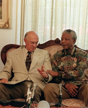 PW Botha and Nelson Mandela meet at Botha's home in Wilderness in 1995. (AFP)